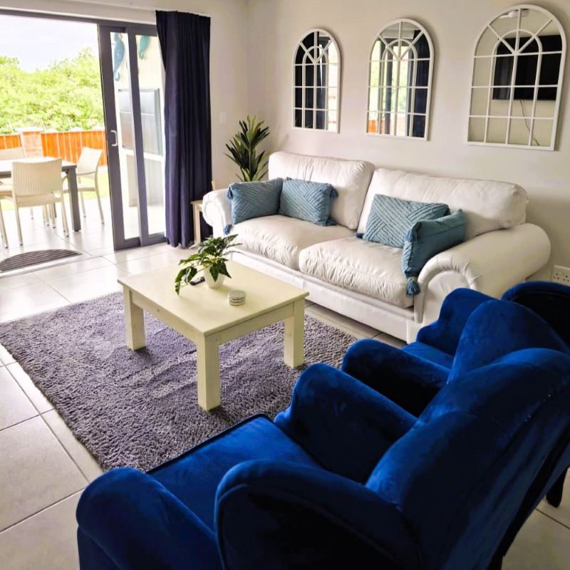 Living room with white and blue couches